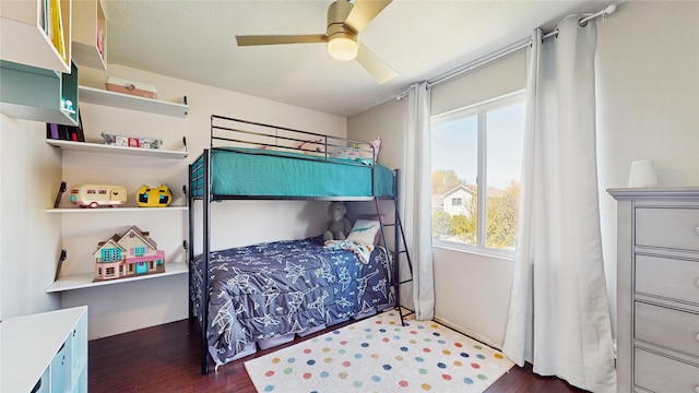 1009 SE 5th St, Grimes, IA 50111 - bedroom with multiple windows, wood finished floors, and ceiling fan