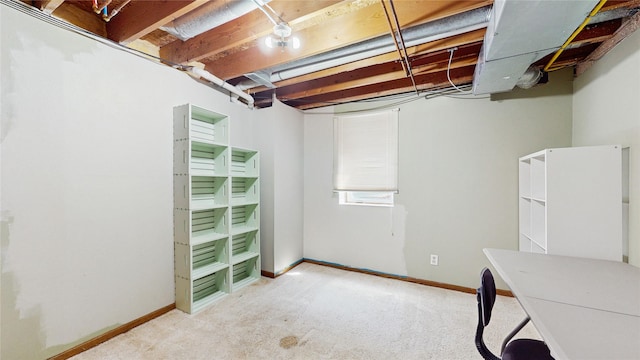1009 SE 5th St, Grimes, IA 50111 - below grade area with baseboards and carpet floors