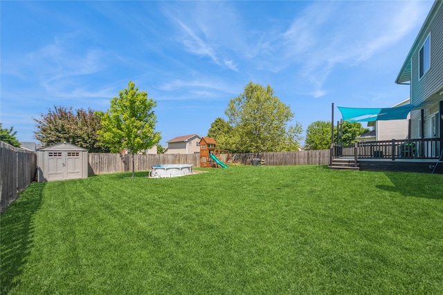1009 SE 5th St, Grimes, IA 50111 - view of yard with a playground and a wooden deck