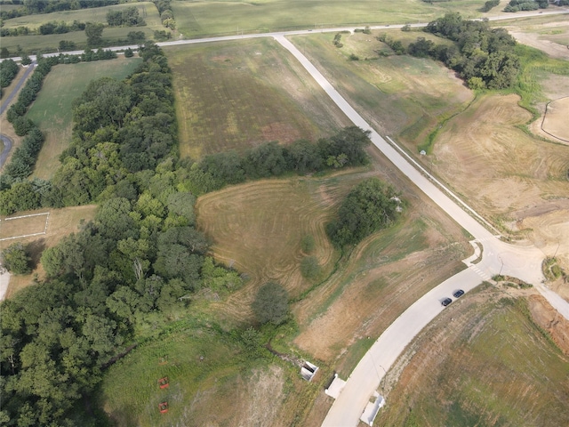 birds eye view of property featuring a rural view
