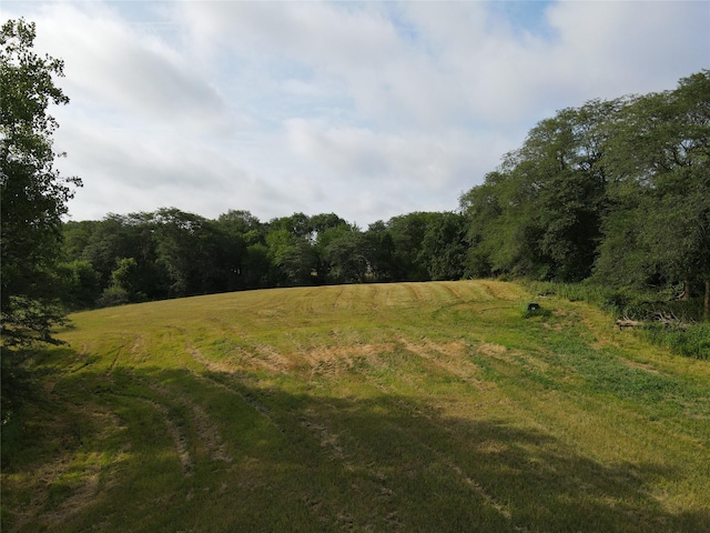 view of landscape with a rural view and a forest view