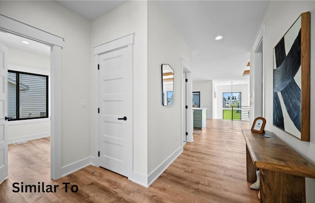 355 NW Red Oak Dr, Waukee, IA 50263 - hallway featuring baseboards, recessed lighting, and wood finished floors