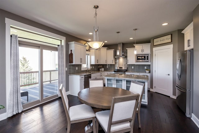 dining area featuring recessed lighting, dark wood finished floors, and visible vents