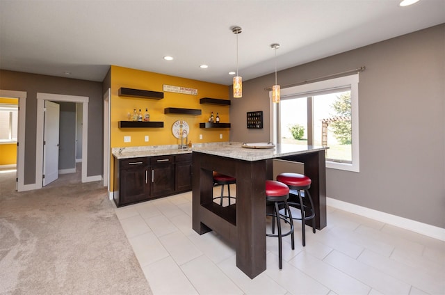 interior space featuring pendant lighting, baseboards, recessed lighting, and wet bar