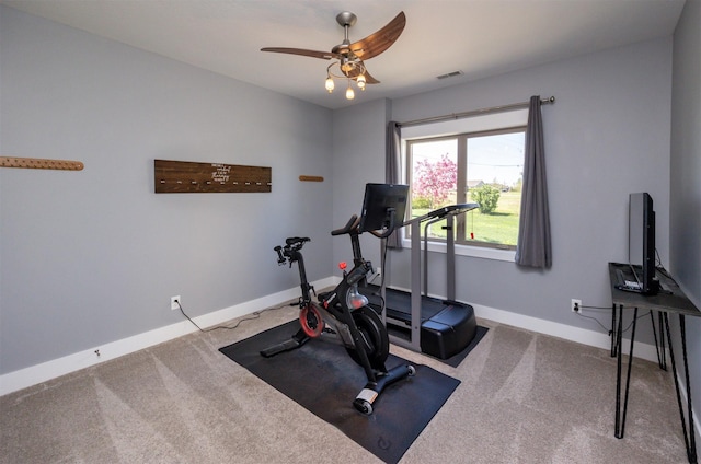 workout room with baseboards, ceiling fan, visible vents, and carpet floors