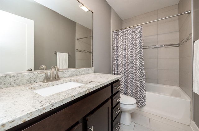 full bath featuring tile patterned floors, vanity, toilet, and shower / tub combo