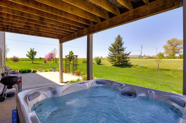view of patio / terrace with a hot tub and area for grilling