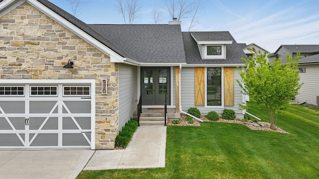 970 Roman Rd, Waukee, IA 50263 - view of front of home with french doors, roof with shingles, a garage, a front lawn, and stone siding