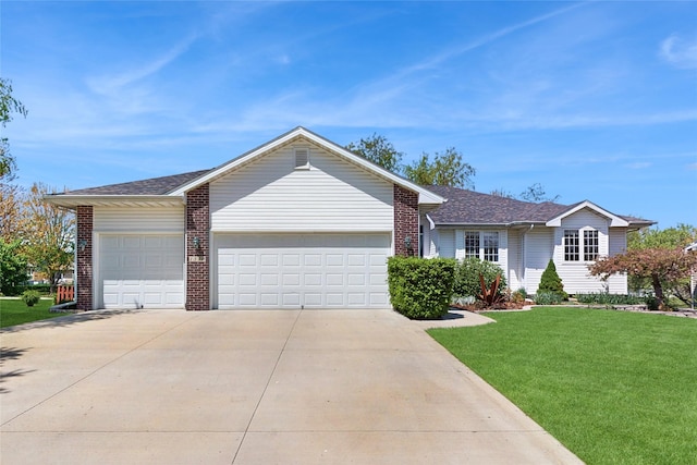 ranch-style house featuring a front yard, roof with shingles, brick siding, concrete driveway, and an attached garage