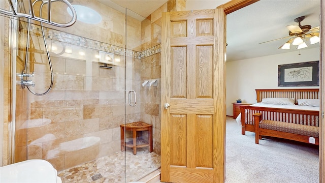 bathroom featuring a ceiling fan, ensuite bathroom, and a stall shower