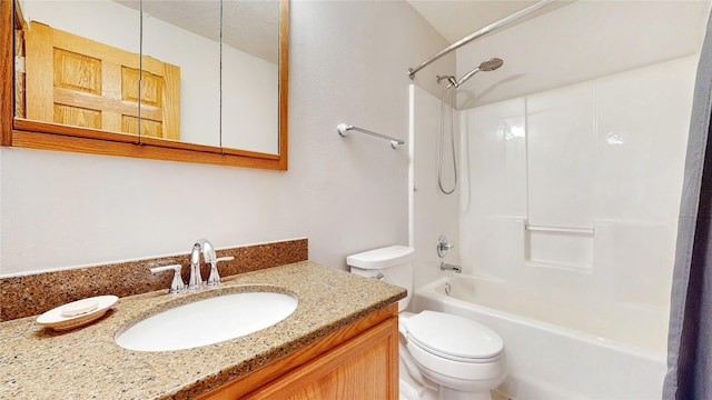 bathroom with vanity, shower / bathtub combination, and toilet