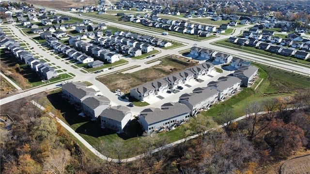 birds eye view of property with a residential view