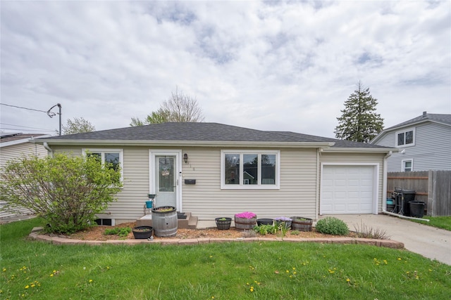 single story home with concrete driveway, fence, a front yard, and a garage