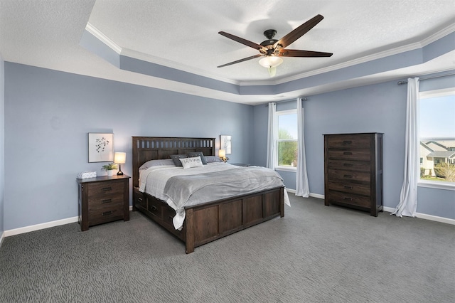 7517 NW 97th Ct, Johnston, IA 50131 - carpeted bedroom featuring ornamental molding, a tray ceiling, a textured ceiling, baseboards, and ceiling fan