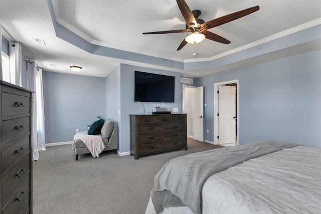 7517 NW 97th Ct, Johnston, IA 50131 - carpeted bedroom featuring a tray ceiling, ornamental molding, and a ceiling fan