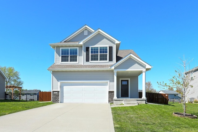 view of front facade with driveway, roof with shingles, fence, a front lawn, and an attached garage