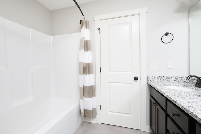 full bath featuring vanity, tile patterned flooring, and shower / bath combo with shower curtain
