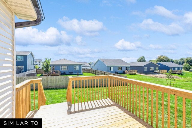 2917 6th Ave SW, Altoona, IA 50009 - wooden deck featuring a residential view, a lawn, and a fenced backyard