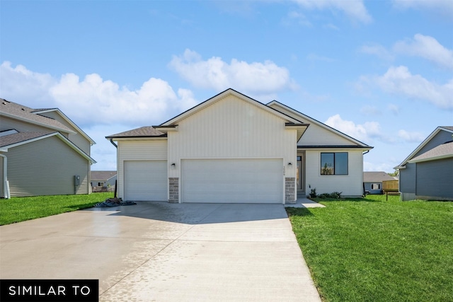 2917 6th Ave SW, Altoona, IA 50009 - ranch-style home featuring concrete driveway, a front lawn, stone siding, and a garage