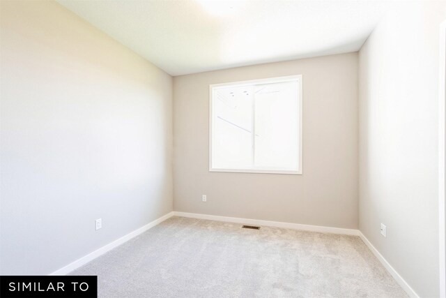 2917 6th Ave SW, Altoona, IA 50009 - carpeted spare room featuring baseboards and visible vents