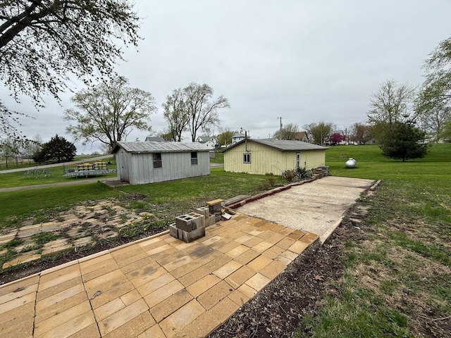 114 S Maple St, Gilman, IA 50106 - view of patio featuring an outdoor structure