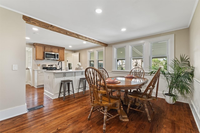 dining room featuring crown molding, recessed lighting, baseboards, visible vents, and dark wood-style floors