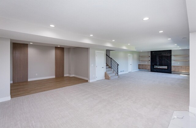 17778 Hammontree Dr, Clive, IA 50325 - finished basement with light carpet, stairs, recessed lighting, and baseboards