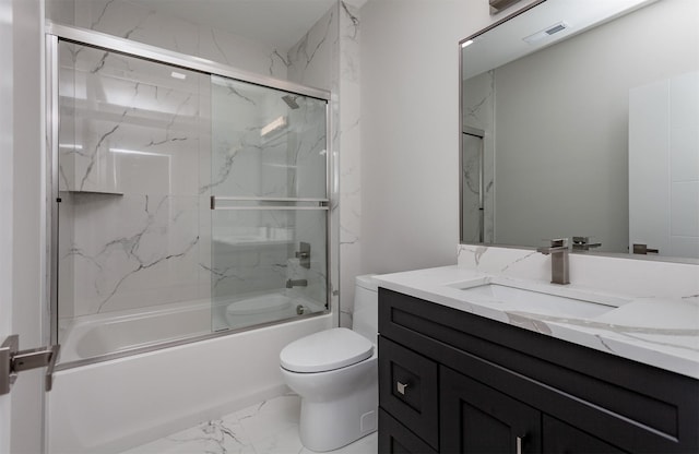full bathroom featuring visible vents, vanity, marble finish floor, toilet, and enclosed tub / shower combo