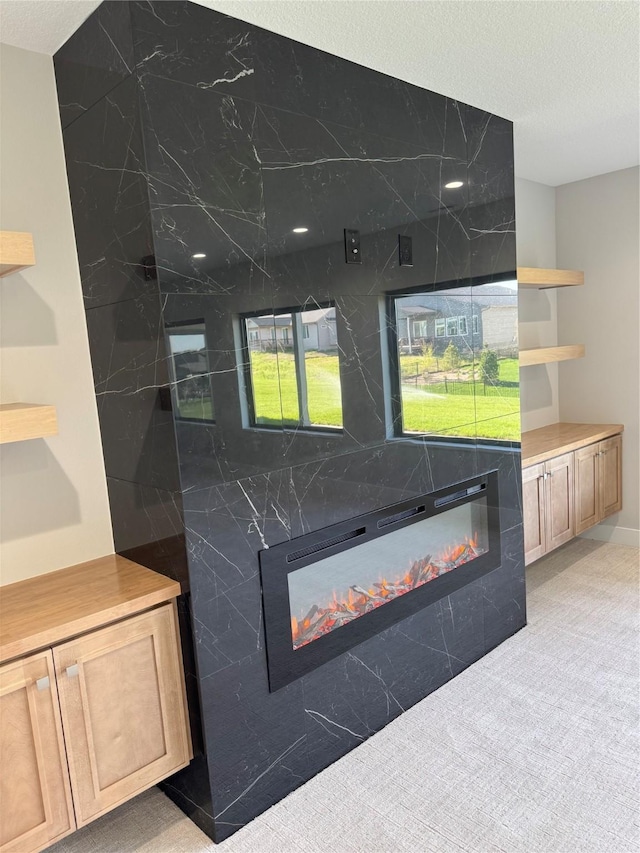 reception area featuring a glass covered fireplace