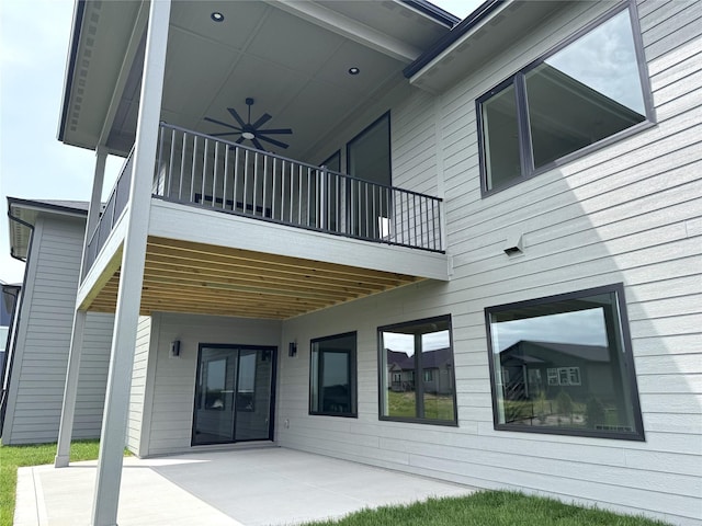rear view of house featuring a patio and ceiling fan
