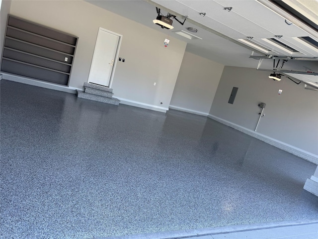17778 Hammontree Dr, Clive, IA 50325 - garage with a garage door opener and baseboards