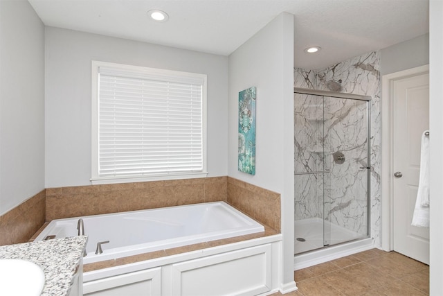 188 Bridgewood Dr, West Des Moines, IA 50266 - bathroom featuring vanity, a marble finish shower, a garden tub, and recessed lighting