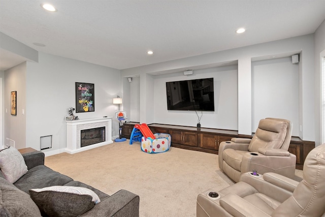 188 Bridgewood Dr, West Des Moines, IA 50266 - carpeted living area with recessed lighting, baseboards, and a glass covered fireplace