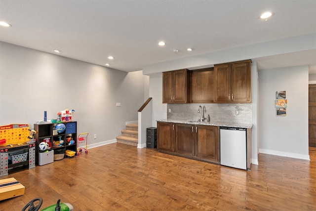 188 Bridgewood Dr, West Des Moines, IA 50266 - bar with a sink, dishwasher, indoor wet bar, recessed lighting, and baseboards