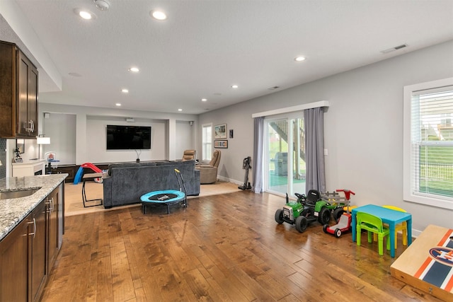 188 Bridgewood Dr, West Des Moines, IA 50266 - living room with recessed lighting, plenty of natural light, and hardwood / wood-style floors