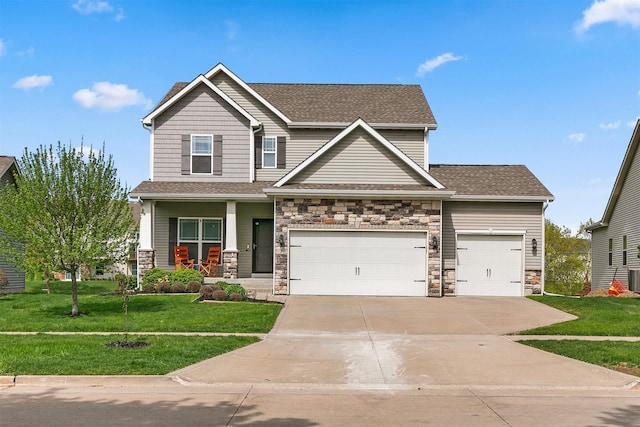 188 Bridgewood Dr, West Des Moines, IA 50266 - craftsman-style house with a porch, a front yard, driveway, and stone siding