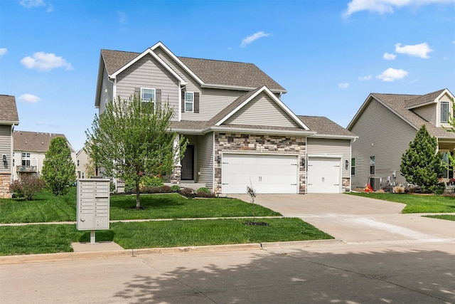 188 Bridgewood Dr, West Des Moines, IA 50266 - view of front of home with a garage, driveway, a front lawn, and stone siding