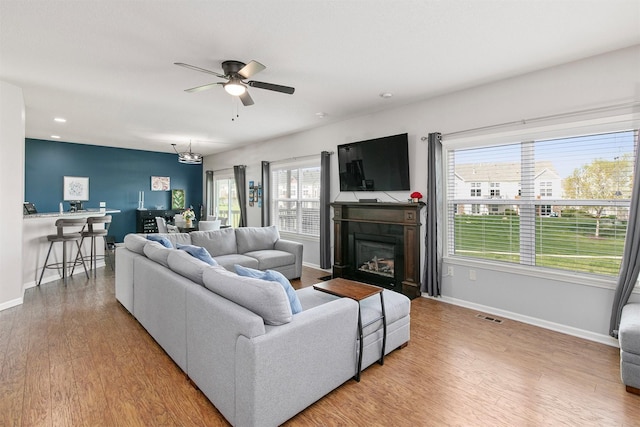 188 Bridgewood Dr, West Des Moines, IA 50266 - living room with baseboards, visible vents, and light wood finished floors