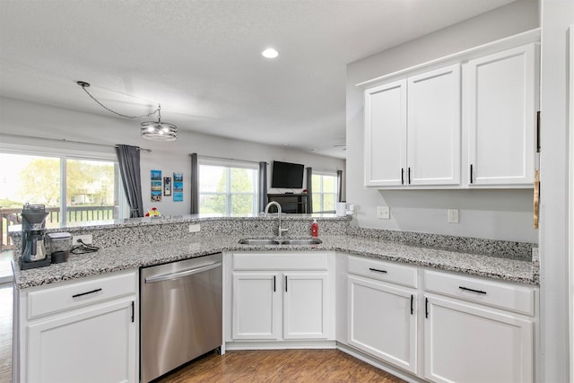 188 Bridgewood Dr, West Des Moines, IA 50266 - kitchen with light stone counters, a sink, dishwasher, white cabinetry, and wood finished floors