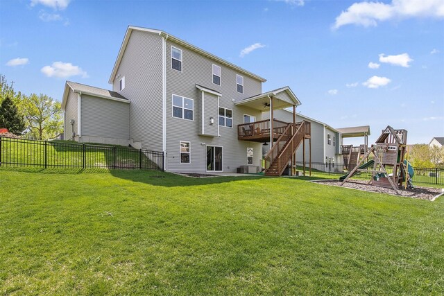188 Bridgewood Dr, West Des Moines, IA 50266 - back of property with a playground, a wooden deck, stairway, a fenced backyard, and a lawn