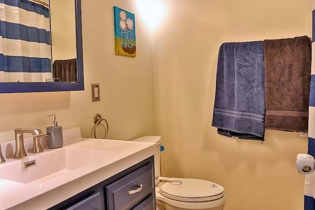 full bath with toilet and vanity