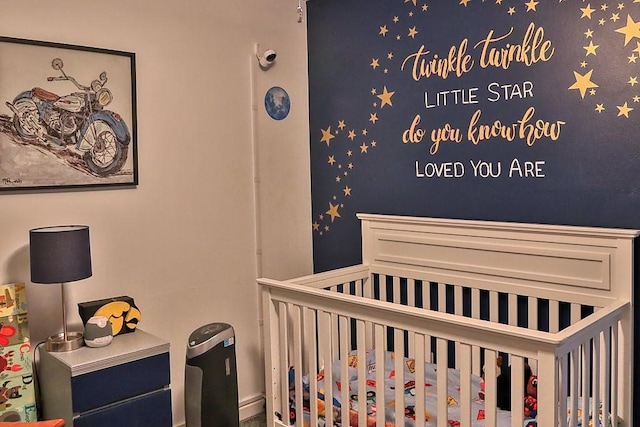 bedroom featuring a crib