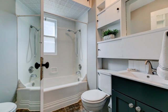 bathroom with toilet, shower / tub combination, and vanity