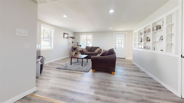 608 12th St, West Des Moines, IA 50265 - living room featuring light wood-type flooring, recessed lighting, baseboards, and built in shelves