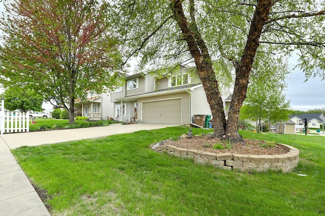 traditional home with driveway, a front lawn, and a garage