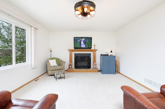 interior space featuring visible vents, baseboards, and a tile fireplace