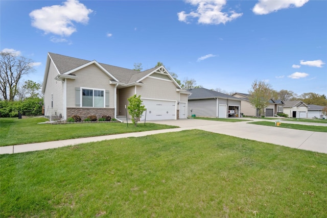 single story home featuring concrete driveway, an attached garage, and a front yard