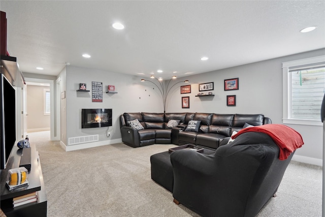 living room featuring recessed lighting, visible vents, and carpet