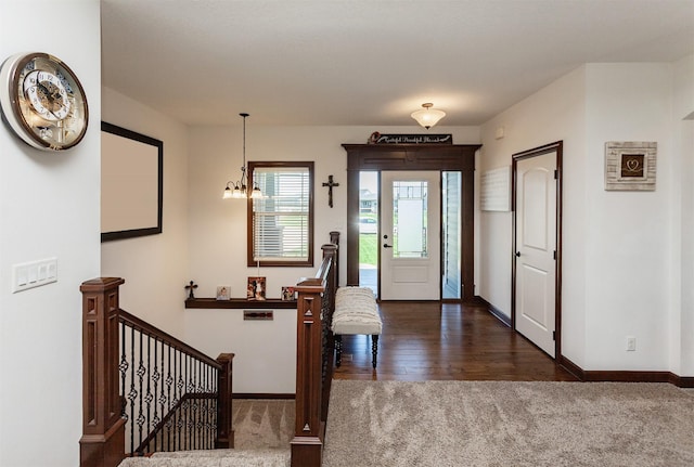 218 34th St SE, Altoona, IA 50009 - entryway featuring carpet flooring, baseboards, and wood finished floors