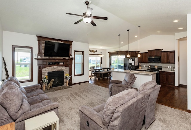 218 34th St SE, Altoona, IA 50009 - living area with vaulted ceiling, a ceiling fan, plenty of natural light, recessed lighting, and light wood-style flooring